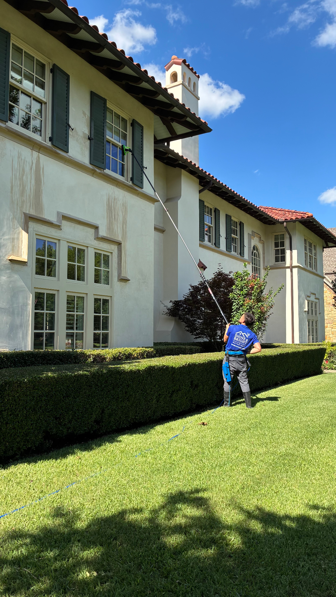 Shine & Bright team detailing a large residential window